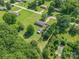 Aerial shot of a brick home featuring a pool and storage at 1145 Craigbrow Cir, Chester, SC 29706