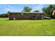 This brick home features a large backyard, and mature trees at 1145 Craigbrow Cir, Chester, SC 29706