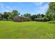 A beautiful, expansive backyard features a storage shed at 1145 Craigbrow Cir, Chester, SC 29706