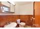 Small bathroom with wood paneling and classic fixtures at 1145 Craigbrow Cir, Chester, SC 29706