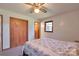Comfortable bedroom with carpet, a ceiling fan, and natural light from the window at 1145 Craigbrow Cir, Chester, SC 29706