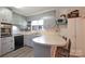 Charming kitchen with light blue cabinets, laminate countertops, and stainless steel appliances at 1145 Craigbrow Cir, Chester, SC 29706