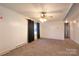 Spacious living room featuring paneling, carpet and ceiling fan at 1145 Craigbrow Cir, Chester, SC 29706