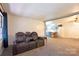 Cozy living room featuring a reclining sofa and view of the kitchen at 1145 Craigbrow Cir, Chester, SC 29706