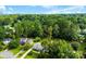 Beautiful aerial view of the property nestled among mature trees, offering privacy and a serene, natural setting at 118 Creek Hollow Trl, Belmont, NC 28012