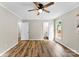 This spacious bedroom features wood-look flooring, a ceiling fan, and natural light at 118 Creek Hollow Trl, Belmont, NC 28012