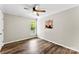 Bedroom with light walls, wood-look floors, lots of light and a modern ceiling fan at 118 Creek Hollow Trl, Belmont, NC 28012