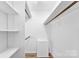 Walk in closet with shelving and wood look floors, perfect for organization and storage at 118 Creek Hollow Trl, Belmont, NC 28012