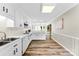 Spacious kitchen with white cabinetry, tiled backsplash, and wood plank flooring at 118 Creek Hollow Trl, Belmont, NC 28012