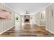 Open-concept living room with wood plank floors, a brick fireplace, and neutral wall colors at 118 Creek Hollow Trl, Belmont, NC 28012