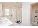 Well-lit bathroom featuring a tub, shower, and toilet at 128 Hickory Ridge Dr, Locust, NC 28097