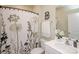 Bathroom with floral shower curtain and decorative vanity at 128 Hickory Ridge Dr, Locust, NC 28097