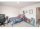 A bedroom with light walls, a window, and gaming themed accessories at 128 Hickory Ridge Dr, Locust, NC 28097