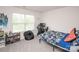Bright bedroom featuring a gamer setup, beanbag chair, and large window at 128 Hickory Ridge Dr, Locust, NC 28097