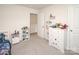 Well-lit bedroom with shelving for storage and toys at 128 Hickory Ridge Dr, Locust, NC 28097