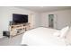 A bedroom with a bed and a TV on a stand with multiple doors nearby at 128 Hickory Ridge Dr, Locust, NC 28097