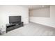 Bonus room with dark tv stand and neutral walls at 128 Hickory Ridge Dr, Locust, NC 28097