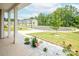 A home's front yard view from the porch, showing a well-maintained lawn and neighborhood setting at 128 Hickory Ridge Dr, Locust, NC 28097
