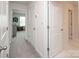 Hallway featuring three doors leading to various rooms throughout the house at 128 Hickory Ridge Dr, Locust, NC 28097