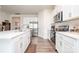 Contemporary kitchen featuring stainless steel appliances, white cabinetry, and a functional layout at 128 Hickory Ridge Dr, Locust, NC 28097