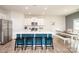 Modern kitchen featuring a large island with bar seating, stainless steel appliances, and open layout at 128 Hickory Ridge Dr, Locust, NC 28097
