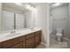 Bathroom with double sink vanity, and a bath/shower combo with a sliding glass door at 128 Yellowbell Rd, Mooresville, NC 28117