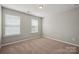 Standard room design with neutral carpet, a window, and simple design at 128 Yellowbell Rd, Mooresville, NC 28117