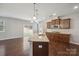 Kitchen with center island, stainless steel appliances and access to the back patio at 128 Yellowbell Rd, Mooresville, NC 28117