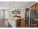 Spacious kitchen boasts granite countertops, an island, and stainless steel appliances at 128 Yellowbell Rd, Mooresville, NC 28117