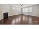 Bright living room features a fireplace and lots of natural light at 128 Yellowbell Rd, Mooresville, NC 28117