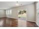 Spacious living room with wood floors and sliding glass doors to the backyard at 128 Yellowbell Rd, Mooresville, NC 28117