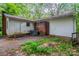 Exterior view of backyard featuring lawn and the building's back wall at 1332 Midwood Dr, Gastonia, NC 28052