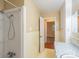Bathroom with built-in shelving and combined tub and shower at 1332 Midwood Dr, Gastonia, NC 28052