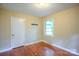 Bedroom with hardwood floors and window at 1332 Midwood Dr, Gastonia, NC 28052