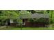 Charming brick home with a covered carport and well-manicured front yard at 1332 Midwood Dr, Gastonia, NC 28052