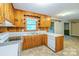Close up on the kitchen, highlighting wood cabinets, countertops and appliances at 1332 Midwood Dr, Gastonia, NC 28052