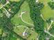 An aerial view of a private home surrounded by lush greenery and mature trees, highlighting its secluded location at 1347 Norman Dr, Rock Hill, SC 29732