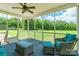 Relaxing screened-in back porch featuring wicker furniture and views of the expansive backyard at 1347 Norman Dr, Rock Hill, SC 29732