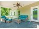 Comfortable screened-in back porch with cushioned seating, ceiling fan, and backyard views at 1347 Norman Dr, Rock Hill, SC 29732