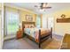 Bedroom showcasing neutral colored walls, windows, ceiling fan, and decorative bed at 1347 Norman Dr, Rock Hill, SC 29732