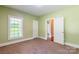 Cozy bedroom with green walls, a window, and two closets with doors at 1347 Norman Dr, Rock Hill, SC 29732