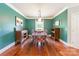 Dining room features natural light, wood floors, and painted green walls at 1347 Norman Dr, Rock Hill, SC 29732
