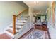 Warm entryway with hardwood floors, staircase, and a glimpse into the cozy living room at 1347 Norman Dr, Rock Hill, SC 29732