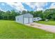 Spacious outbuilding with dual garage doors and adjacent RV parking on a well-manicured lot at 1347 Norman Dr, Rock Hill, SC 29732