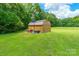 Large outbuilding in a well-maintained yard, complemented by a basketball hoop for added entertainment at 1347 Norman Dr, Rock Hill, SC 29732