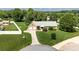 Beautiful brick home with mature trees, well maintained lawn, and long driveway at 139 Hardwick Dr, Mooresville, NC 28115