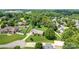 Aerial shot of brick home with lush green lawn in a wooded neighborhood at 139 Hardwick Dr, Mooresville, NC 28115