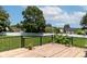 Deck overlooking a lush green backyard and a white fence providing privacy at 139 Hardwick Dr, Mooresville, NC 28115