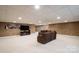 Finished basement with a cozy seating area, television, and neutral carpet at 139 Hardwick Dr, Mooresville, NC 28115