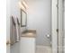 Bright half-bath featuring vanity with granite top, neutral walls, and decorative towels at 139 Hardwick Dr, Mooresville, NC 28115